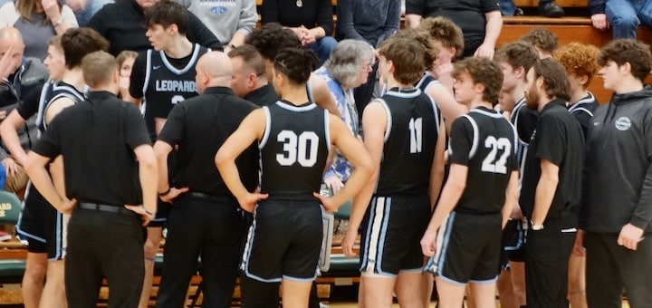 Louisville Leopards Basketball Team Huddled at St. Edward