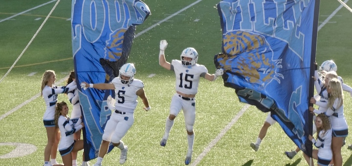 Owen DiMarzio and Gabe Stoffer Runner Through Banner Louisville Football at Alliance